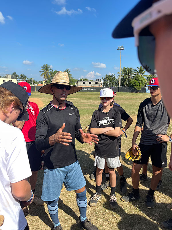 Nate talking with players on field